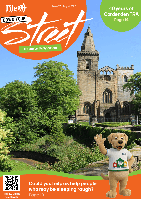 Summer edition of the Down Your Street magazine, showing a historic church surrounded by green trees and gardens.