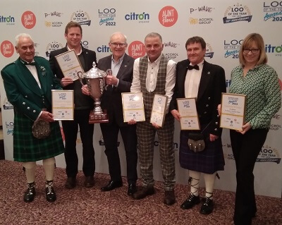 Six of Fife's Coast and Countryside Team standing in a line with their winners certificates - Fife Coast and Countryside Trust clean up at ‘Washroom Oscars’