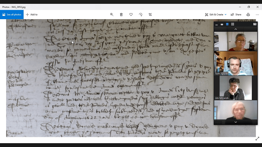Photograph of the group on Zoom deciphering an old document - Innovative archaeology outreach group recognised by National Awards