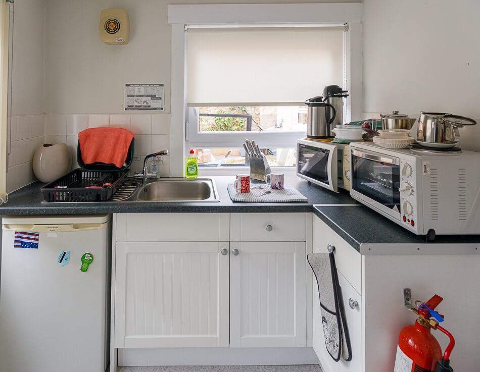 Communal kitchen with washing and cooking facilities at Winthank Court