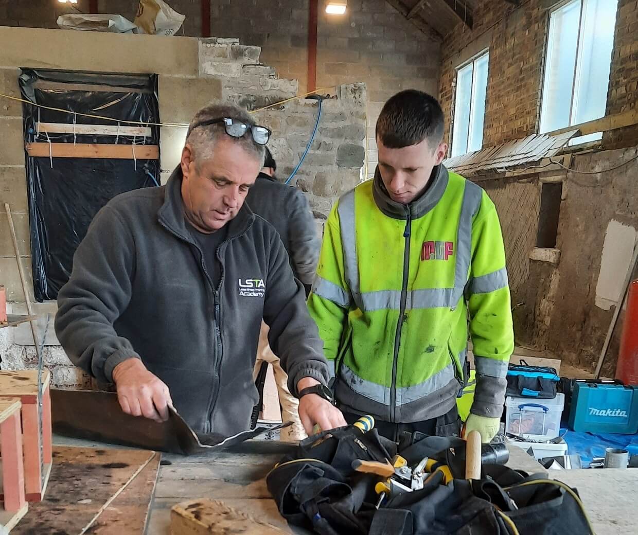 Tutor demonstrates leadwork techniques