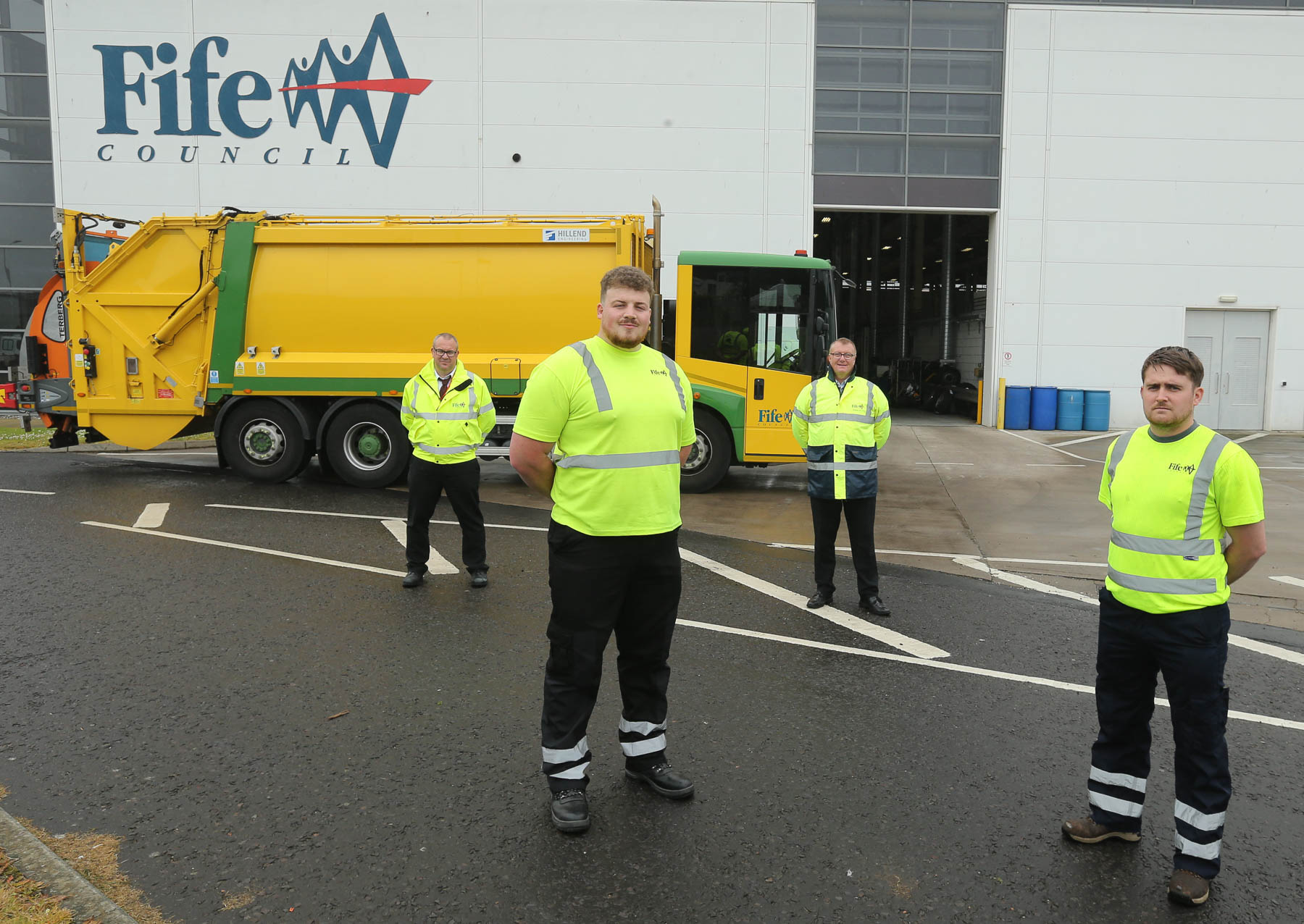 Left to right – Service Operations Manager, Alexander Anderson, 3rd Year Apprentice Plumber, Nathan Colquhoun, Apprentice Scheme Team Manager, Neil MacGregor. 3rd Year Apprentice Plumber, Billy McDowall Four service operators standing in front of Bin lorry
