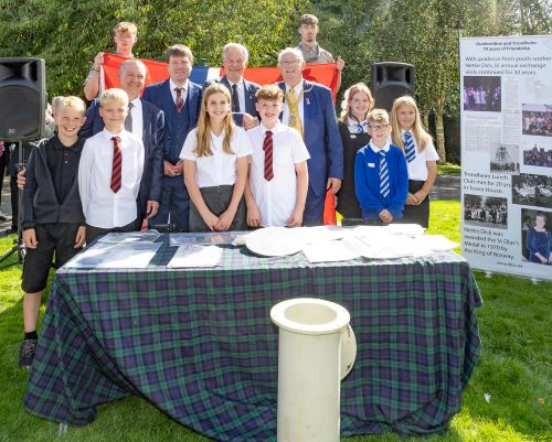 Time Capsule opening - (middle row) Jorn Arve Flatt (Group Leader for Labour Party in Trondheim), Cllr James Calder (Area Convener), Erling Moe (Trondheim Vice-Major) and Provost Leishman with the school children from Commercial Primary School and St John's RC Primary School, alongwith local scouts holding the Norwegian flag. - Dunfermline celebrates 80 years of friendship with Trondheim