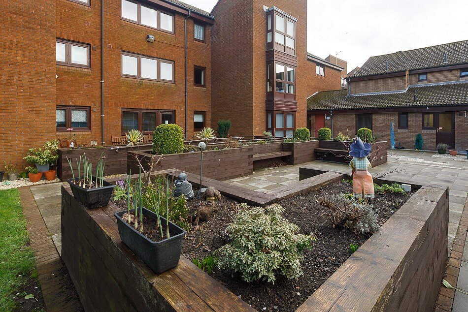 Communal outdoor space, with planters and ornaments outside Spencer House