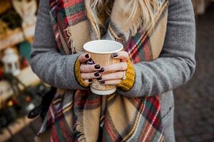 girl holding a cup of hot chocolate girl holding a cup of hot chocolate
