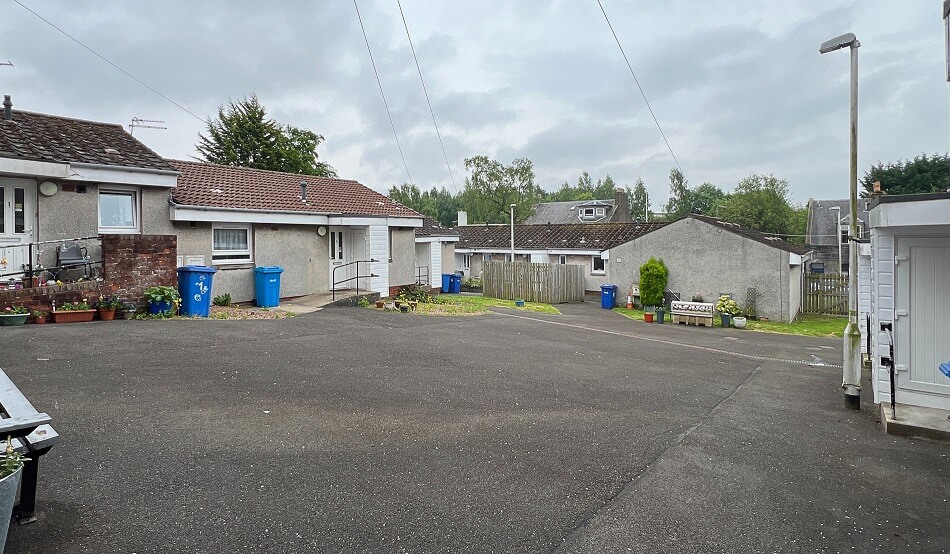 Exterior of Dollar Court, with bungalows forming a cul-de-sac
