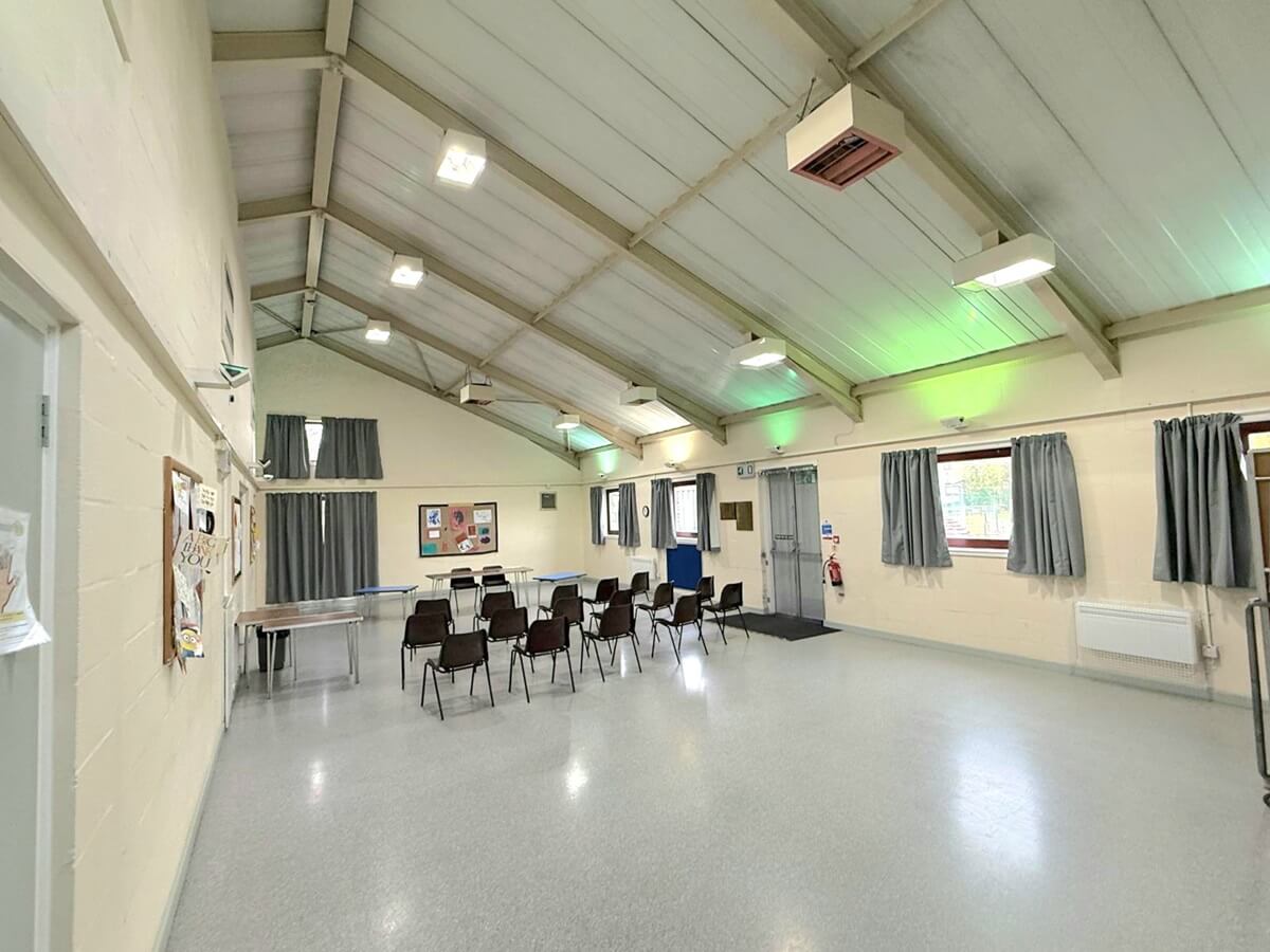 Main hall Pitcorthie hall with table a chair set-up for meeting