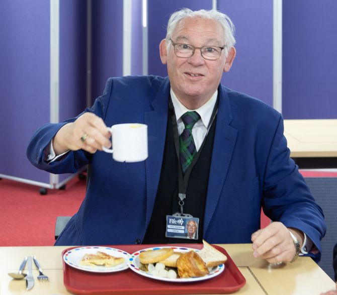 Provost Jim Leishman tucks into a school dinner!