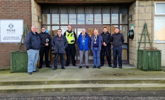 Members of the Levenmouth Area Ctte and police outside Levenmouth police station