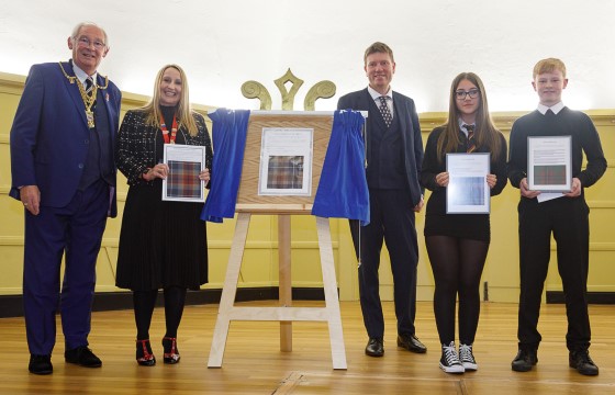 Politicians and Queen Anne High School headteacher and pupils with winning tartan designs. - Dunfermline’s new City Tartan unveiled