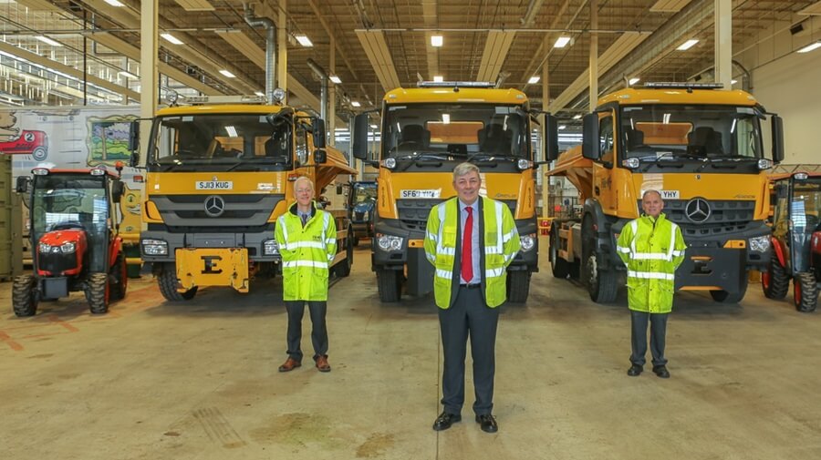 Centre, Cllr Altany Craik, Fife Council Roads and Transportation Spokesperson with left, John Mitchell, Head of Roads and Transportation Services and right, Bill Liddle, Service Manager, Roads Maintenance. Staff standing in front of gritters