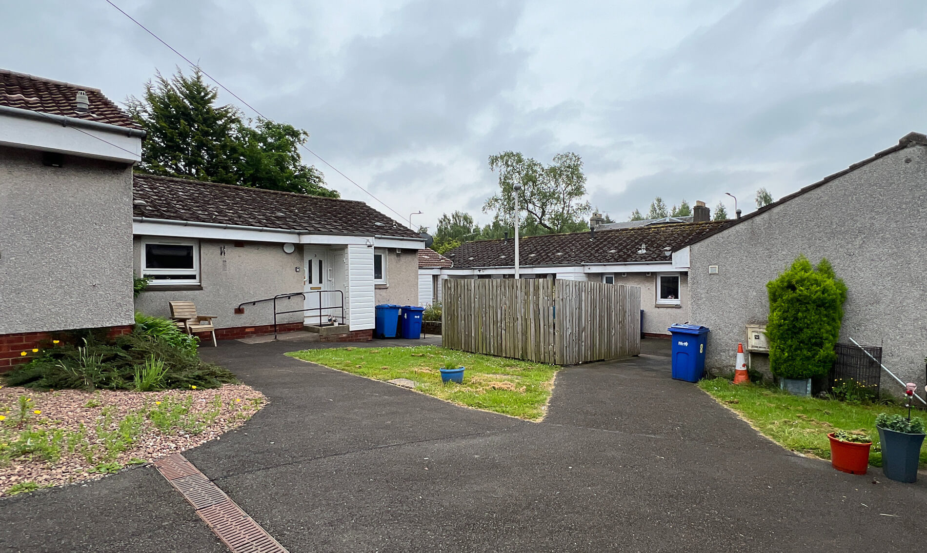 Exterior of Dollar Court, with bungalows leading to their own separate paths