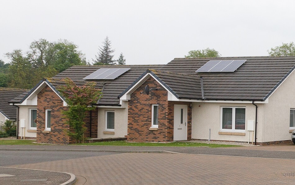 Exterior of bungalows at Oakley with small garden to the front