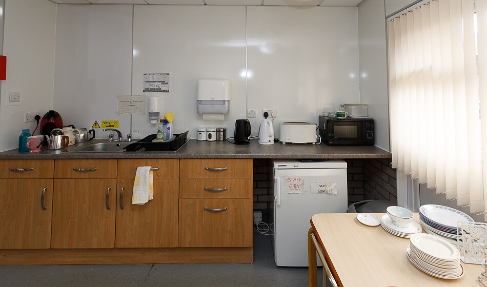 Communal kitchen at Spencer House, with cooking and washing up facilities and communal fridge