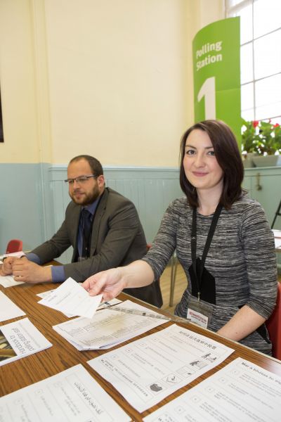 People sitting at a desk - Council election – Opportunity to make extra money