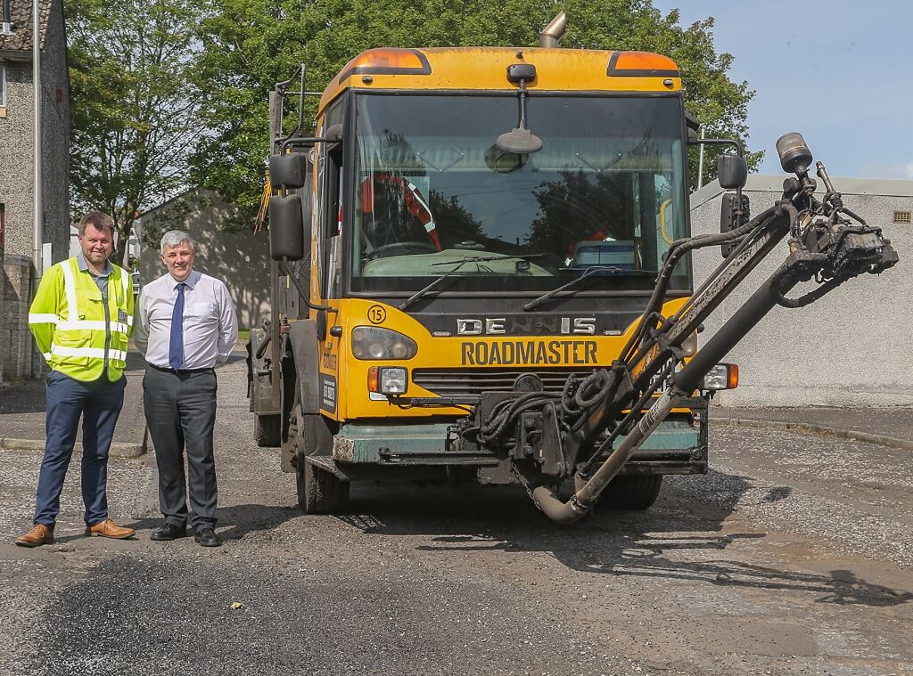 Ian Balfour from the council's roads service with Cllr Altany Craik and the velocity patcher - Council invests extra £3.5 million in Fife's roads