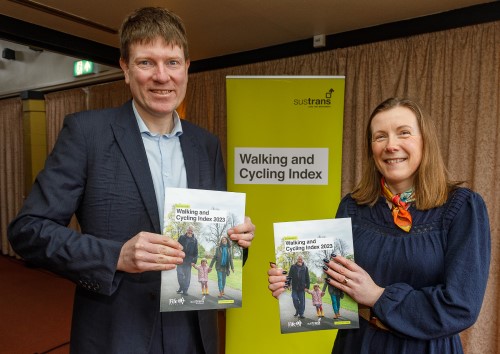 Man and women holding a copy of Dunfermline Walking and Cycling Index 2023. - Dunfermline’s first Walking and Cycling Index