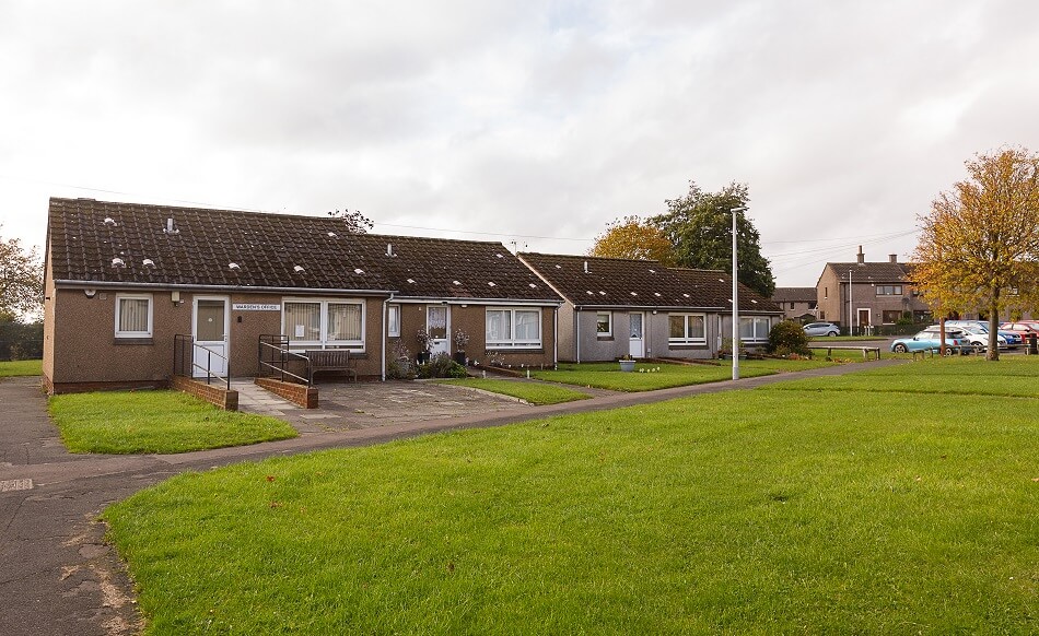 Row of four bungalows at McFarlane Court, with small front gardens