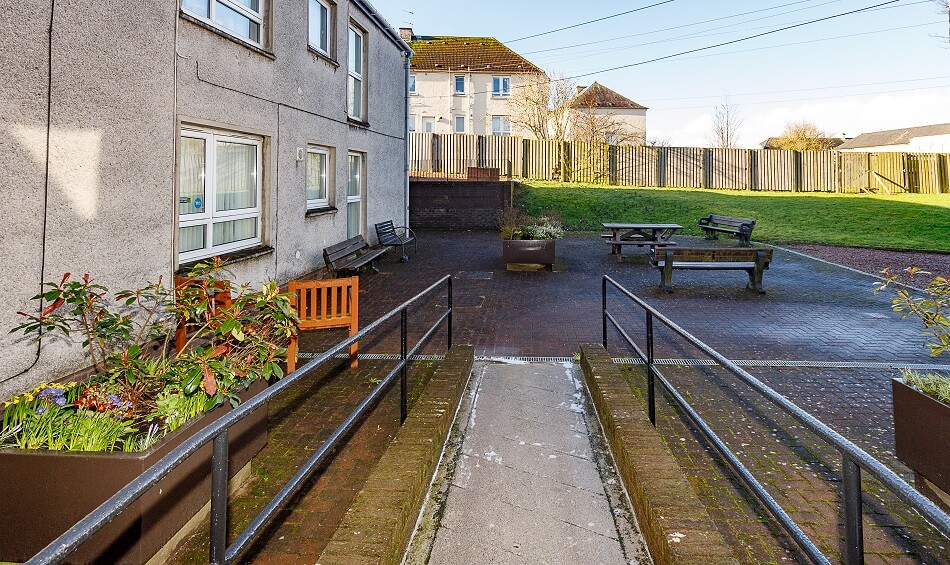Ramp access at the rear of the property at Meldrum Court, leading to communal garden and recreational space