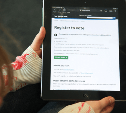 Image of someone holding a tablet, with the Gov.uk 'Register to Vote' page on screen. Image of someone holding a tablet, with the Gov.uk 'Register to Vote' page on screen.