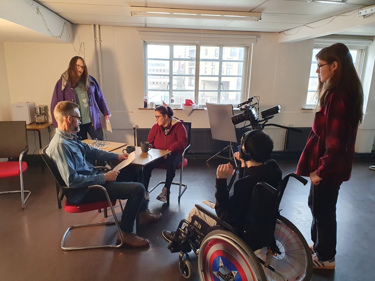 Dunfermline's new filmmaking academy David Izatt with four academy attendees doing practical learning at the Fire Station Creative