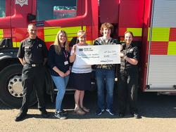 Fife’s Corporate Parent Board receiving a cheque - Corporate Parents Using Pedal Power to Support Kids