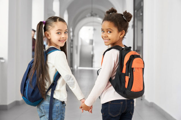 school girls holding hands