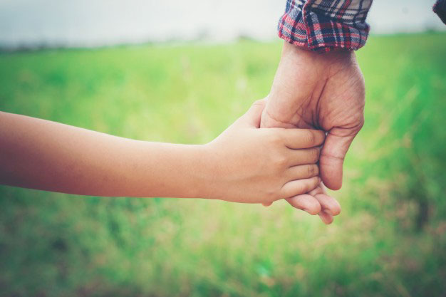 parent and child holding hands