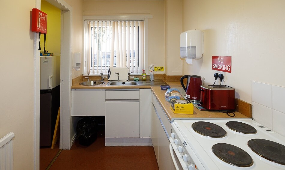 Communal kitchen area at Meldrum Court, with cooking and washing up facilities