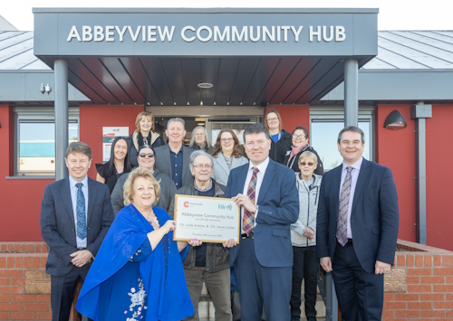 Cllrs Linda Erskine and James Calder at the official opening of Abbeyview Community Hub with community representatives and senior council officials. - Official opening celebrations at Abbeyview Community Hub