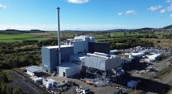 Birds eye view of the Westfield EfW facility, comprising large grey silver buildings with a sunny background.