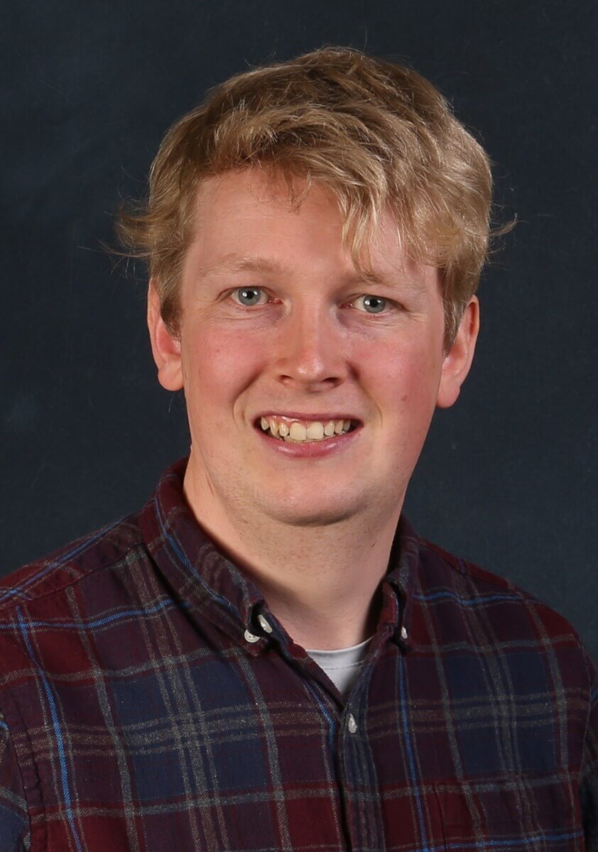 Portrait image of Cllr David Barratt wearing a checked shirt