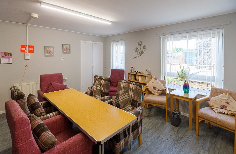 Communal seating area at Melville Court, with long dining table