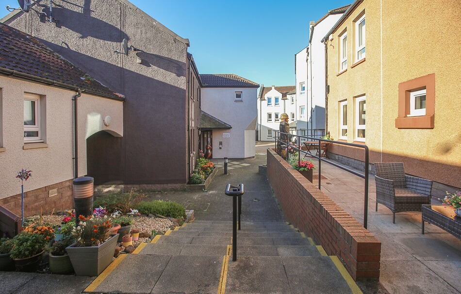 Communal paved area for walking and recreation, to the rear of Harbourlea