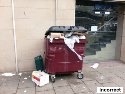 Incorrect - waste containers are presented with open lids and unlocked, overfilled with waste