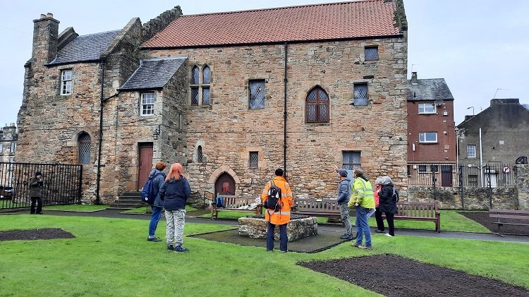Volunteers observing at a community standing building survey of the Friary