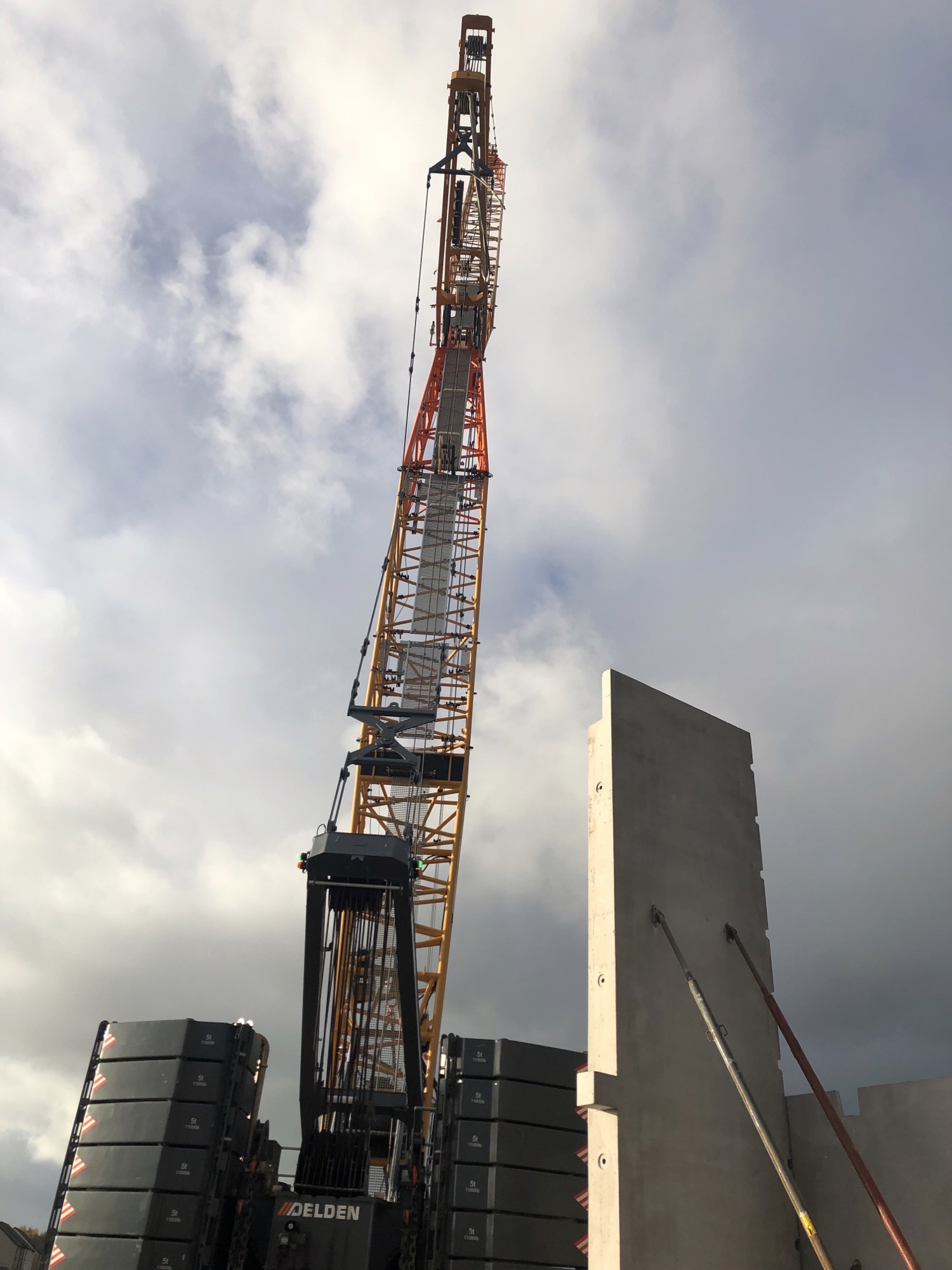 Crane lifting precast panels into place