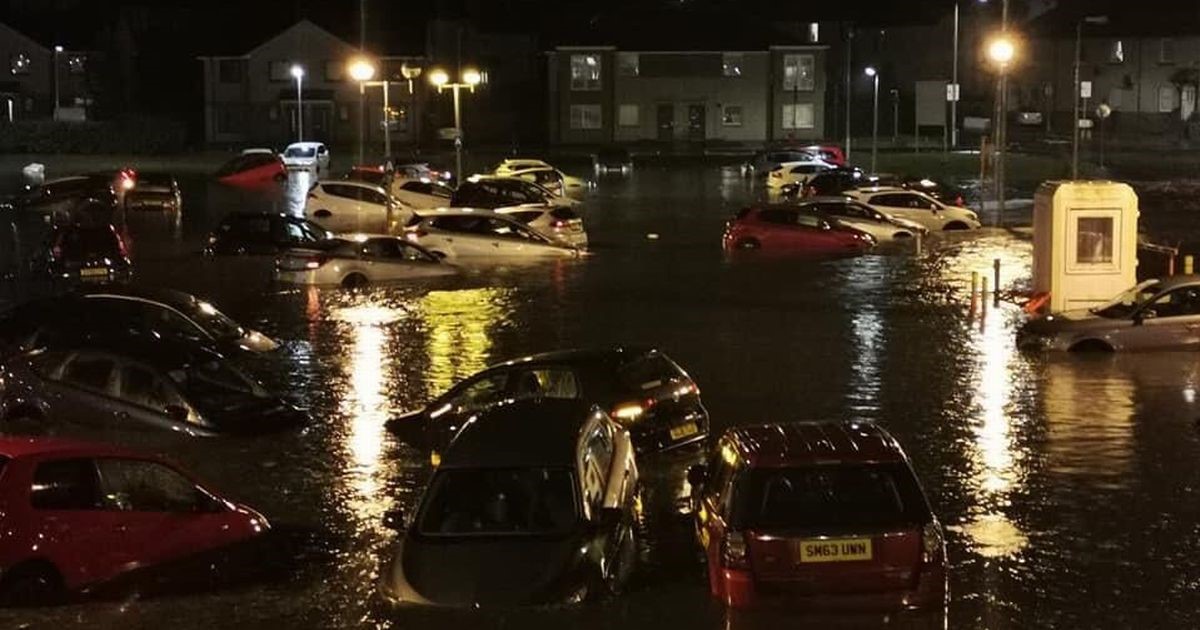 Flooding on the street and submerged cars Flooding on the street and submerged cars