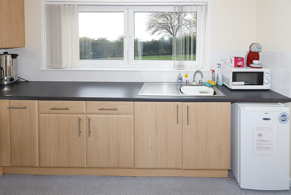 Communal kitchen at McFarlane Court, with sink area and microwave