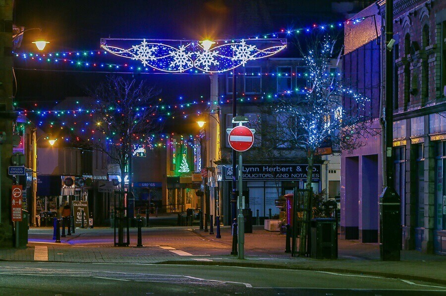 Levenmouth Christmas lights A quiet street at night decorated with colourful Christmas lights and illuminated snowflake displays