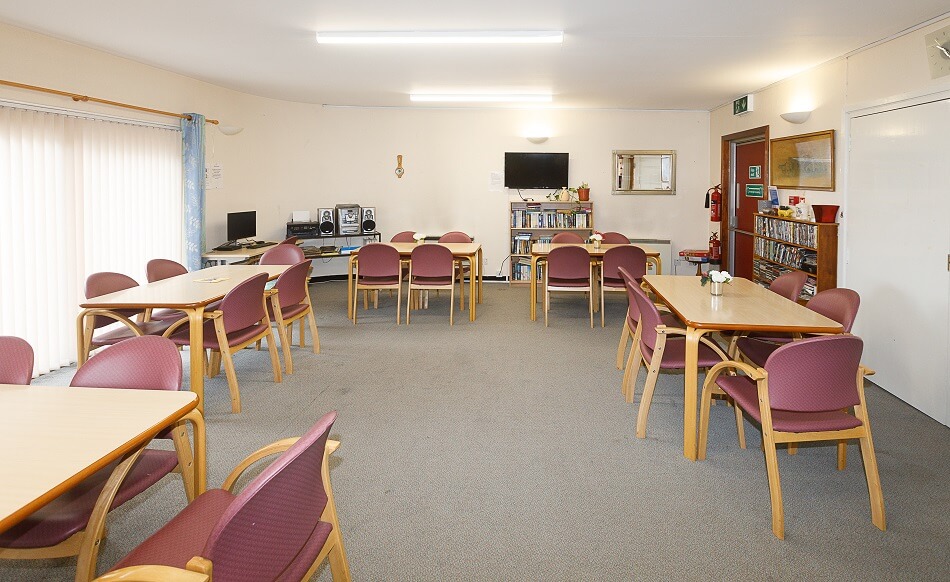 Communal dining area at Walter Hay Court, with tables of four