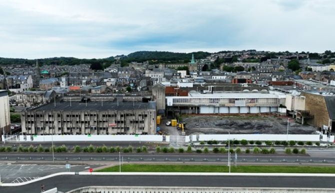 Aerial shot of Kirkcaldy waterfront showing the two multi-storey car parks and old swimming pool site.