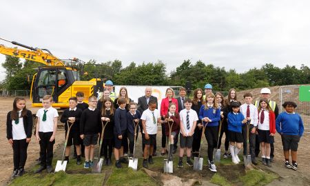 Sod cutting for new high school Local children help to cut the first sod