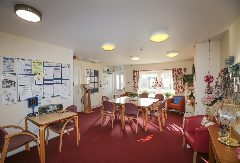 Communal living area at Ross Gardens, with music and games