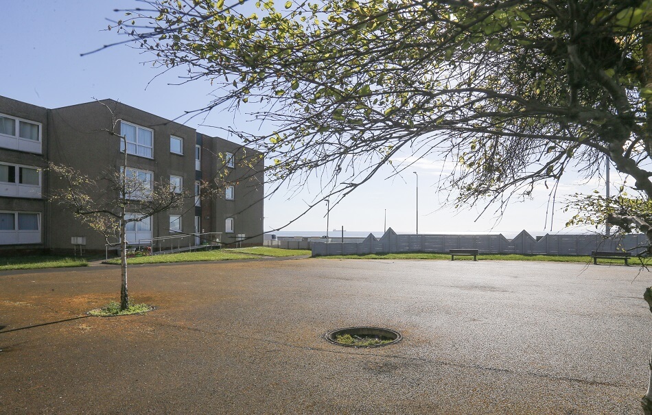 Exterior of Buchanan Court, with large communal ground at the front