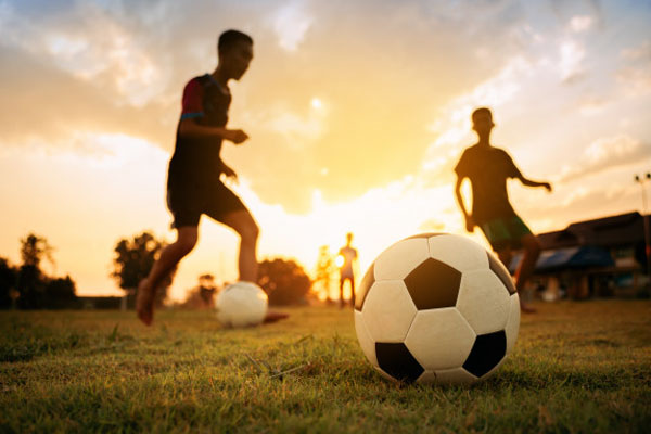 boys playing football