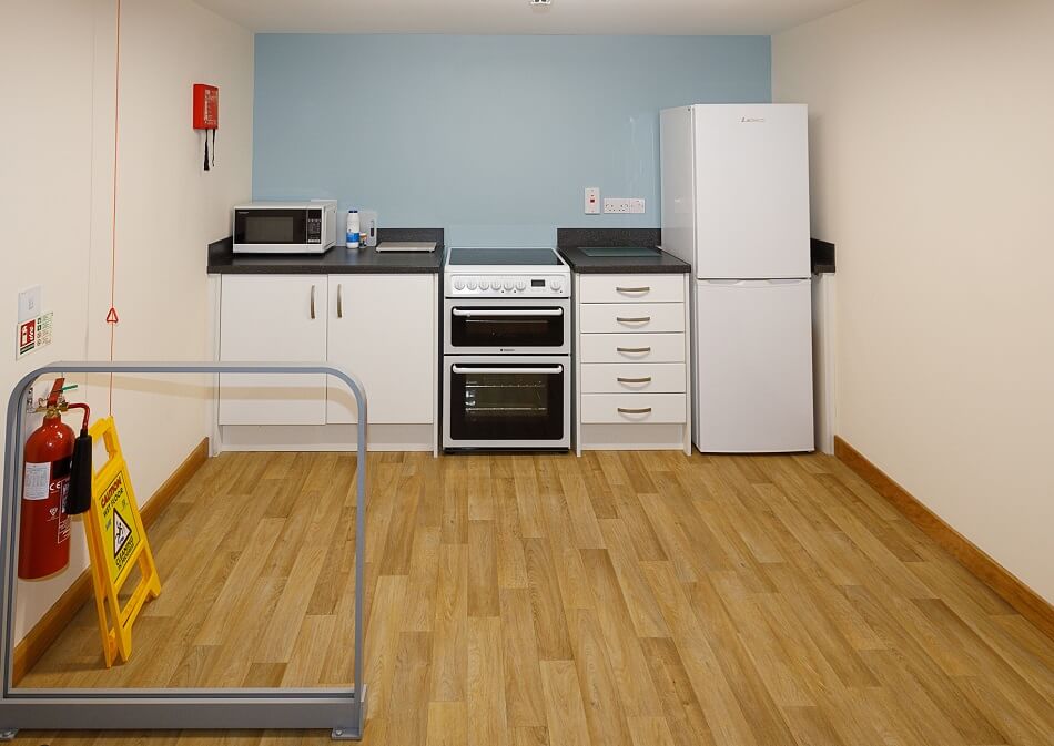 Communal kitchen at Den Court, with small food prep area
