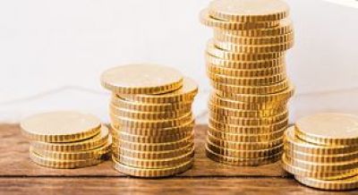 Stack of coins - Helping businesses and vulnerable households remains priority
