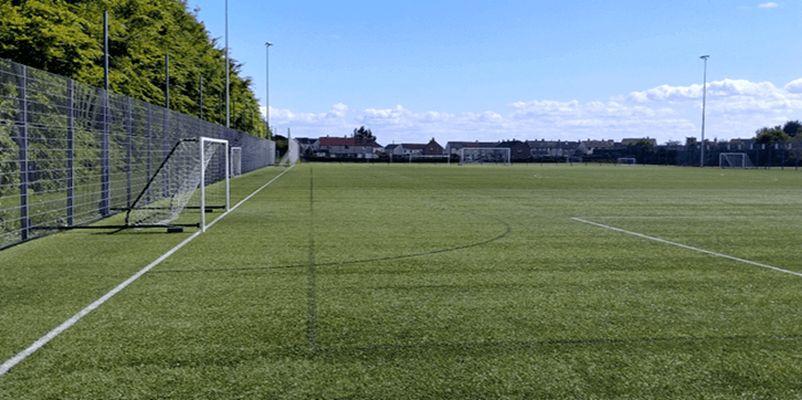 astro pitch A green football pitch. White lines mark the field. Goals stand at each end.