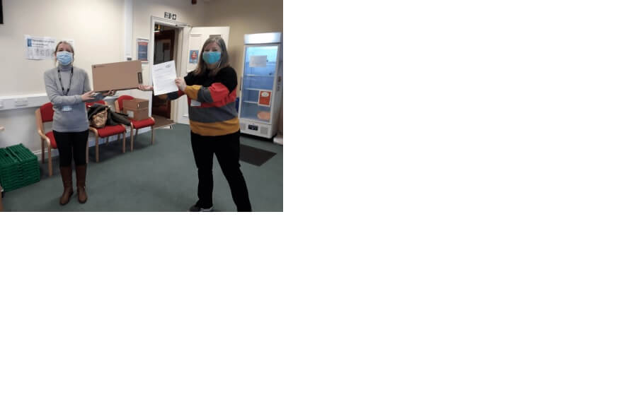 L-R Susan Roden - adult learner/community fridge volunteer and recipient of Connecting Scotland device with Caroline Berry CEW at the Community Fridge - Community workers help to connect North East Fife families